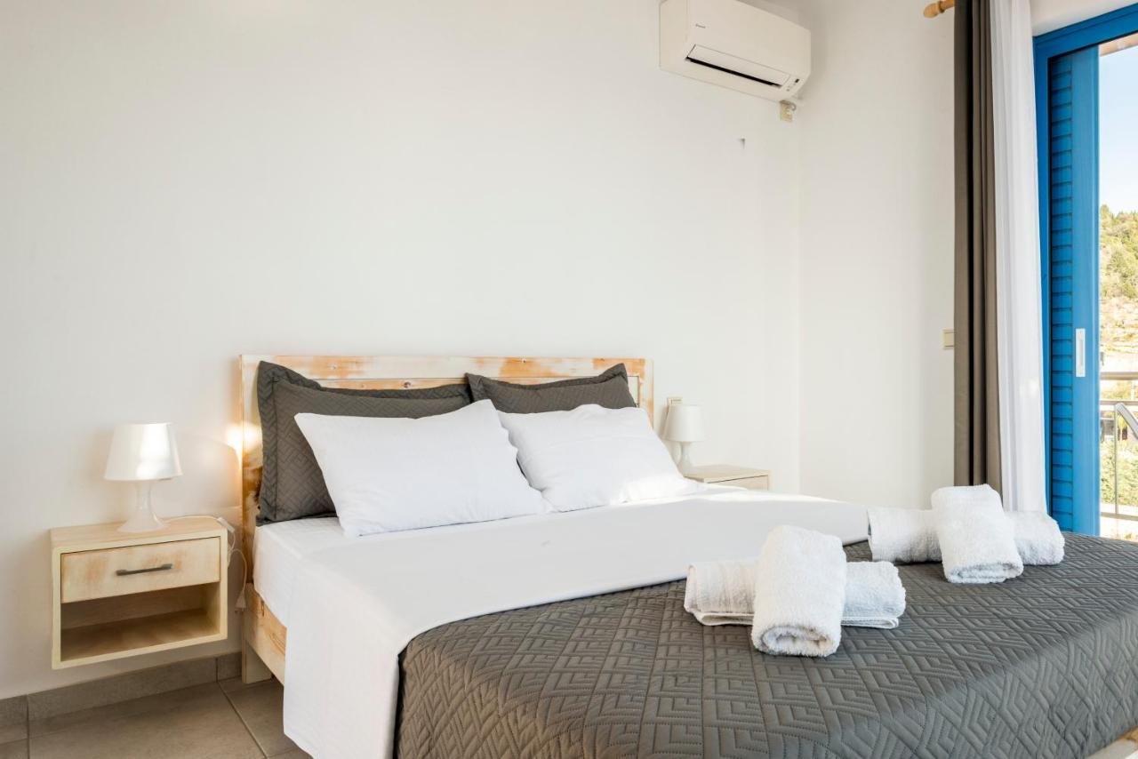 Bright double room at Blue Horizon with wooden bed and balcony