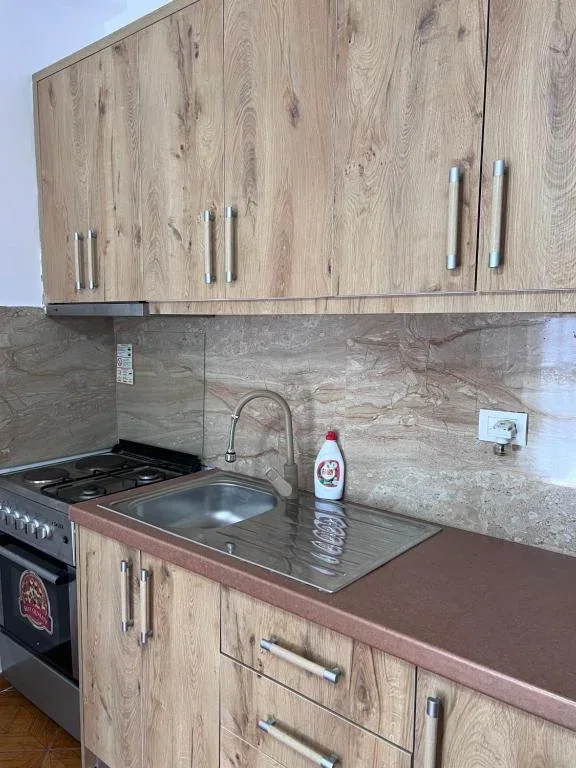The Family Suite kitchen at Hotel Frida with a gas range and a stainless sink