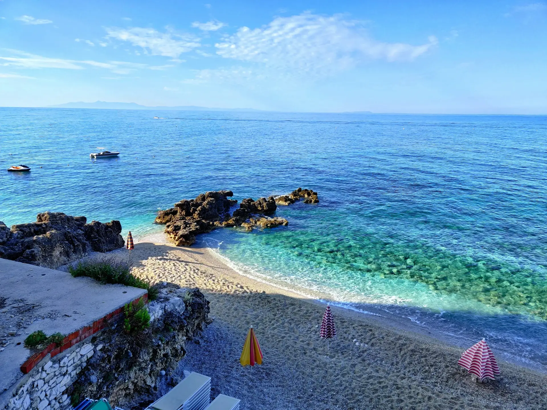 White pebble beach and turquoise Ionian water at Dhermi on the Albanian Riviera