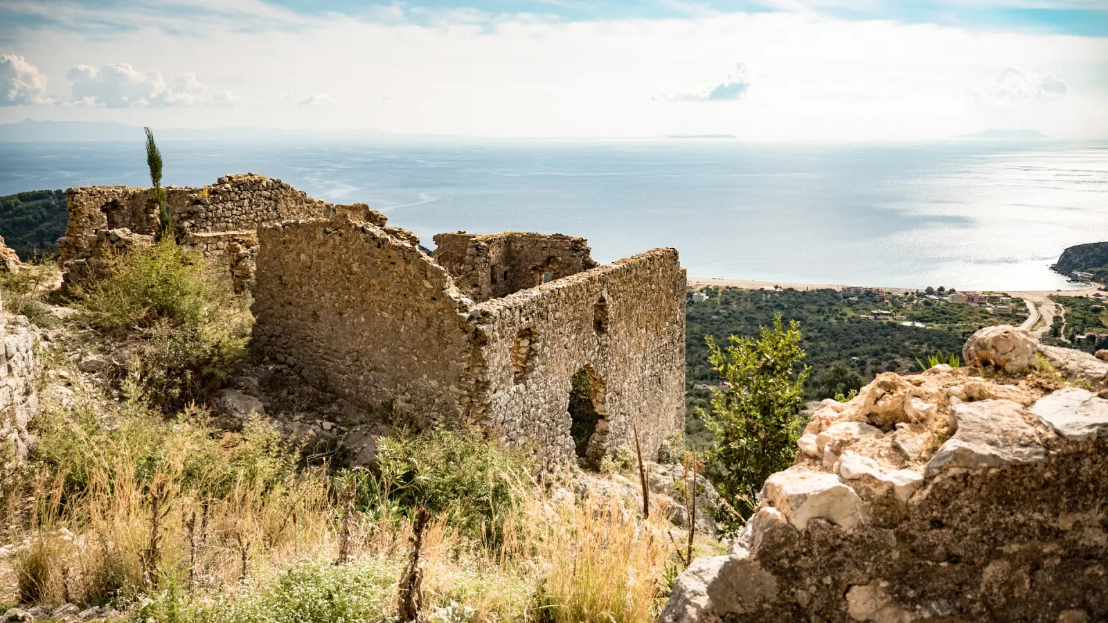 Aerial view of Himara castle ruins and the Albanian Riviera coastline