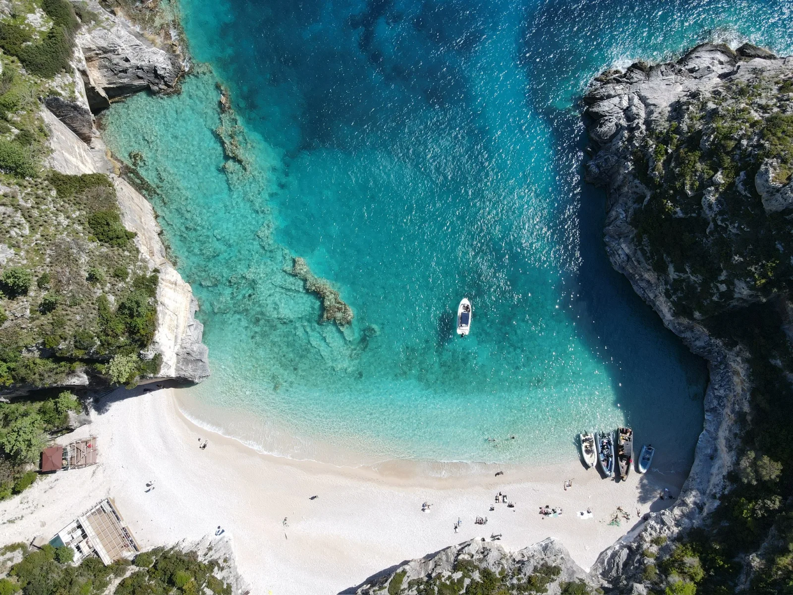 Aerial view of a turquoise Ionian cove on the southern Albanian coast near Saranda