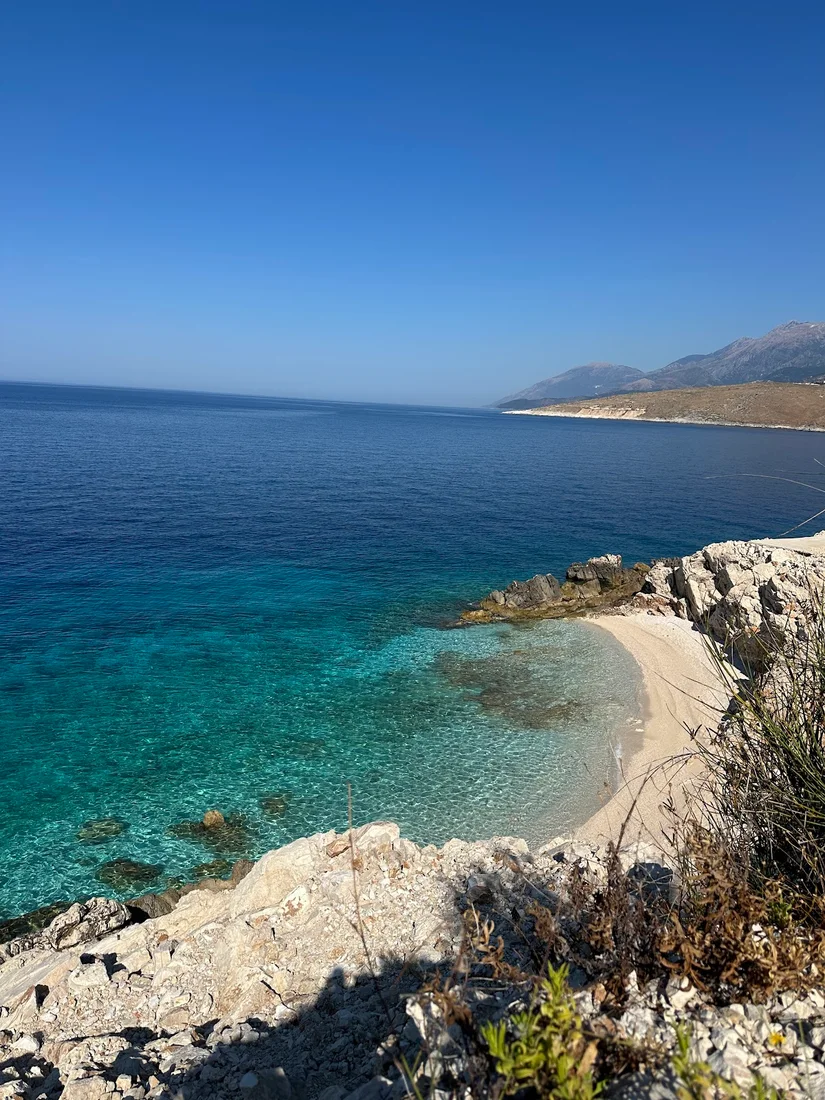 Amallos Beach secluded white pebble cove with clear turquoise water near Porto Palermo south of Himara