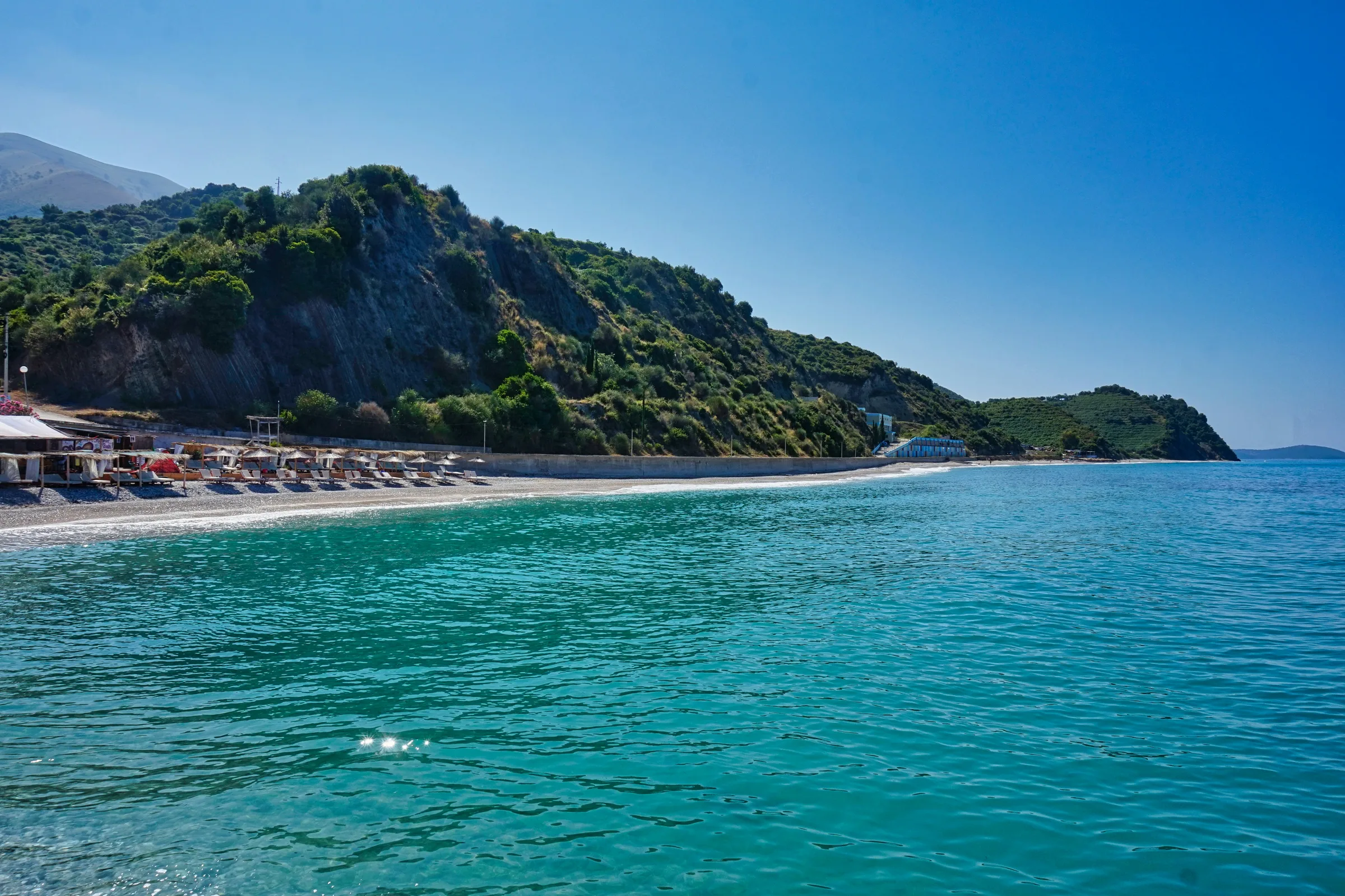 Bunec beach sunset pier — drymades beach guide