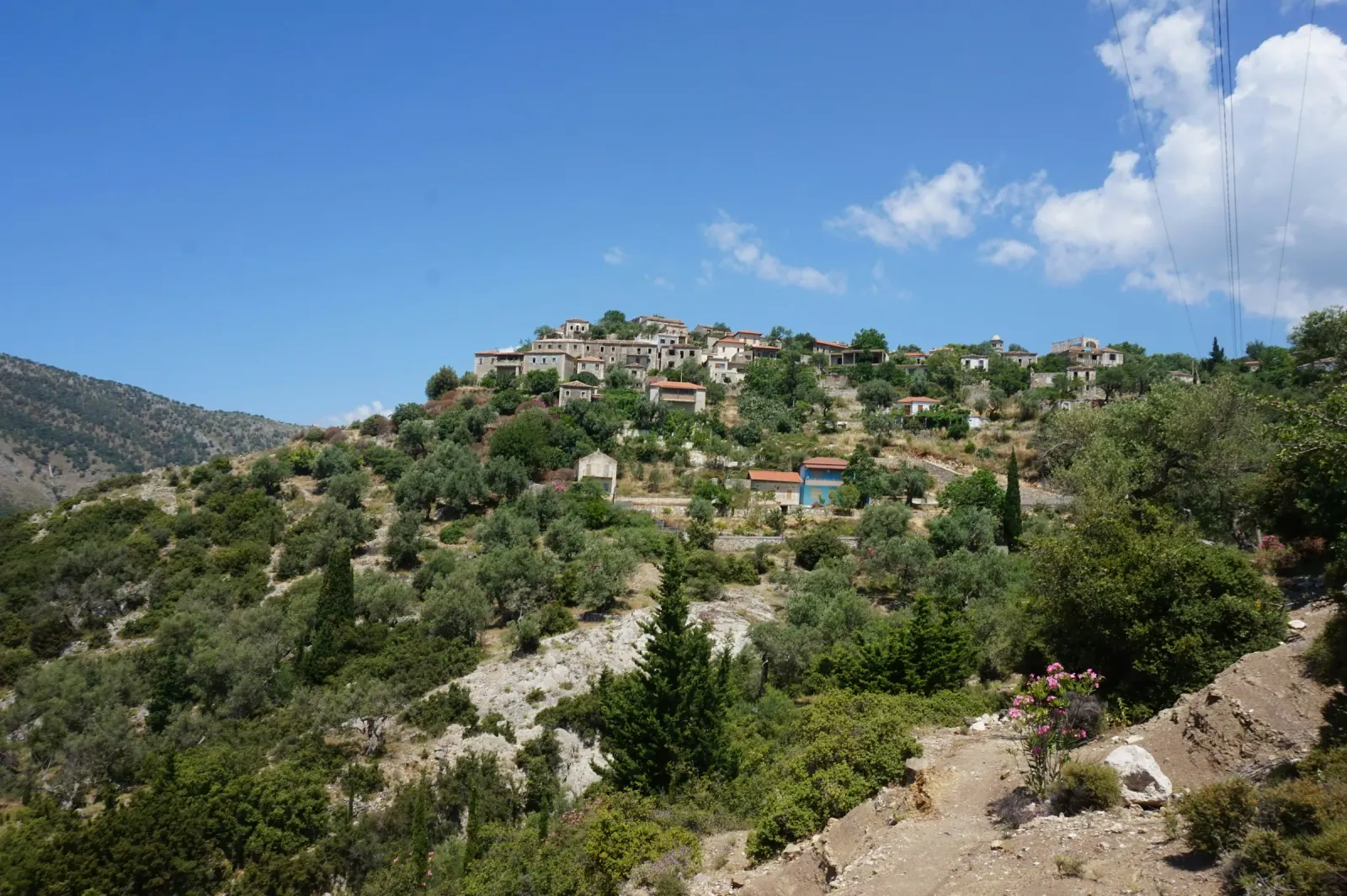 Qeparo Beach waterfront with stone promenade and clear water south of Himara