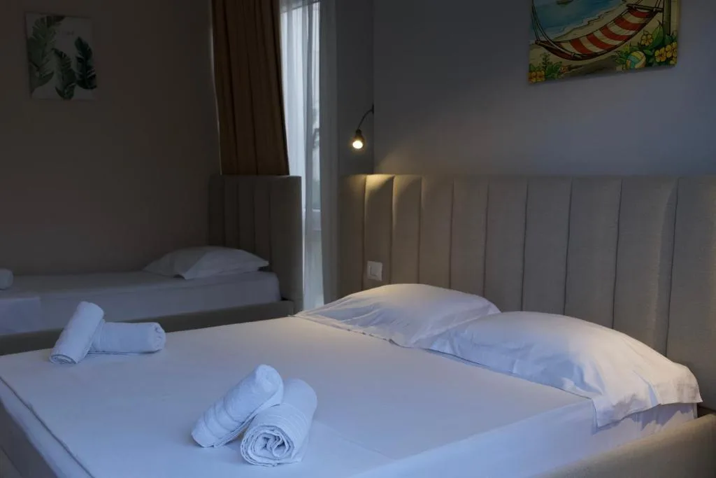 Deluxe Triple Room with Private Veranda at The Blue Wave Hotel
