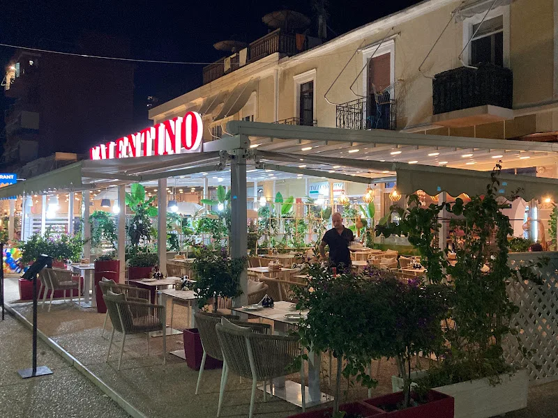 Valentino Restaurant outdoor terrace at night in Himara