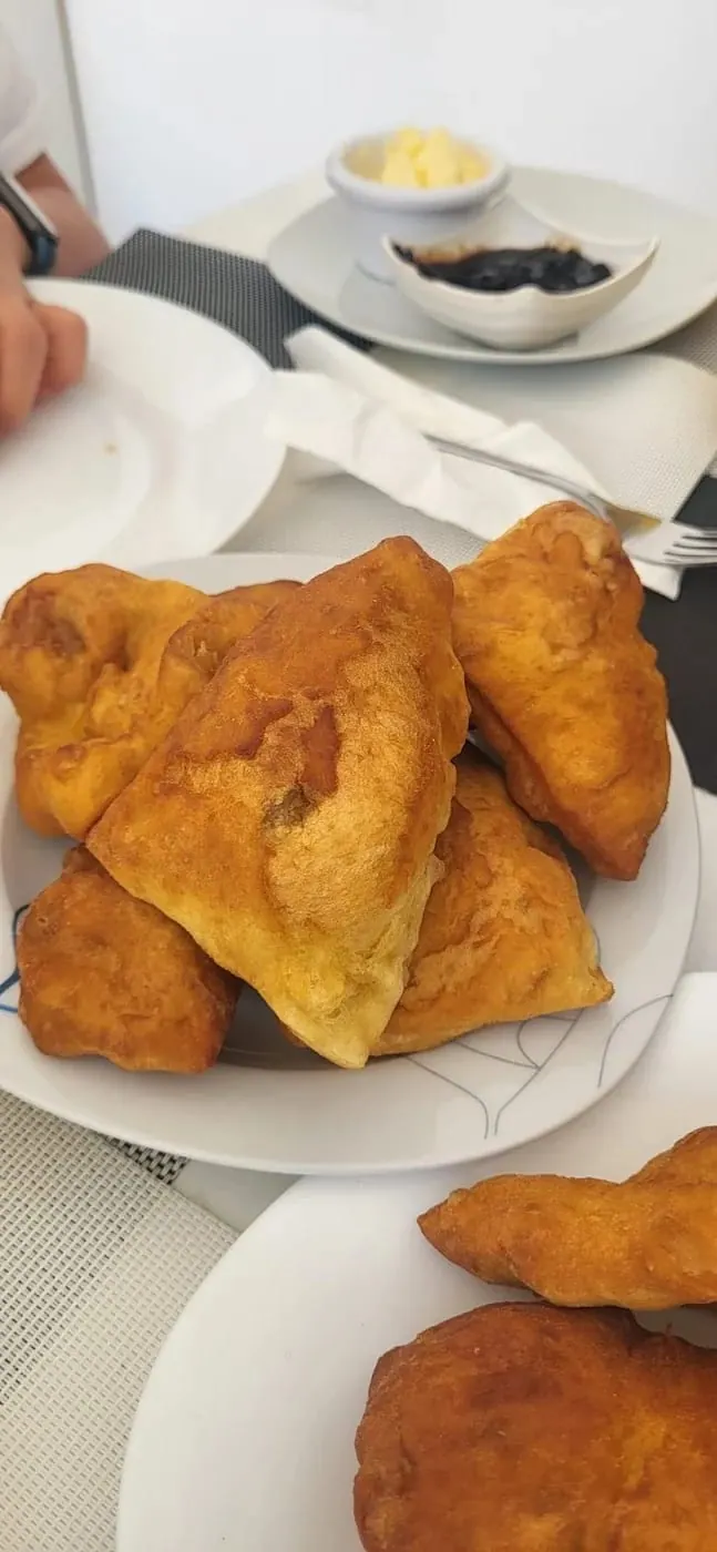 A plate of petulla, Albanian fried dough, served warm at breakfast