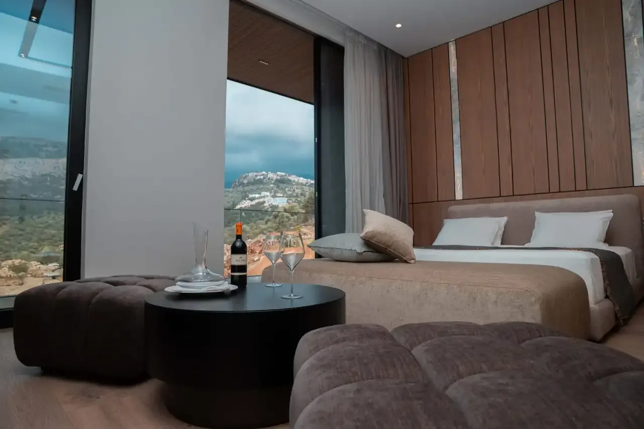 The seating area of a Junior Suite with a low table set with glasses