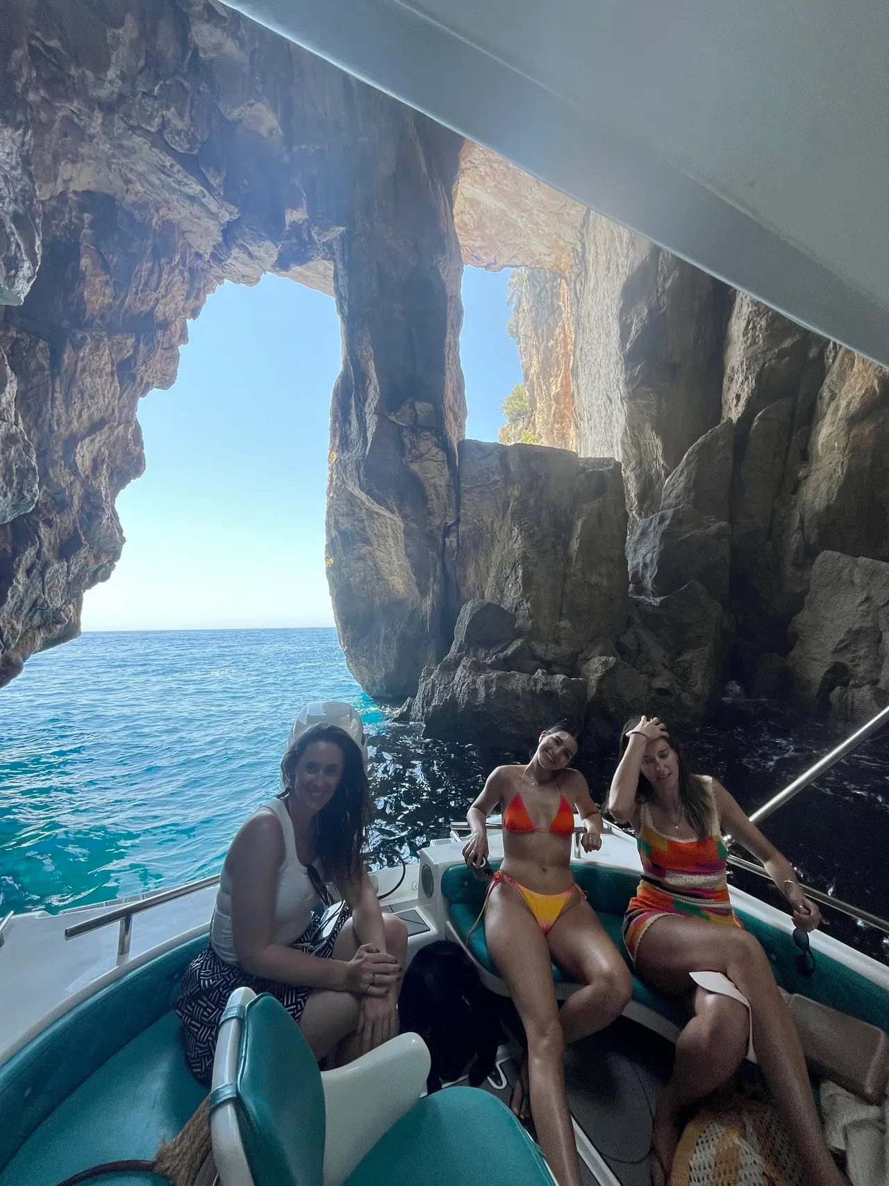Boat tour group inside a Gjipe sea cave on a Dhermi boat tour, Albanian Riviera