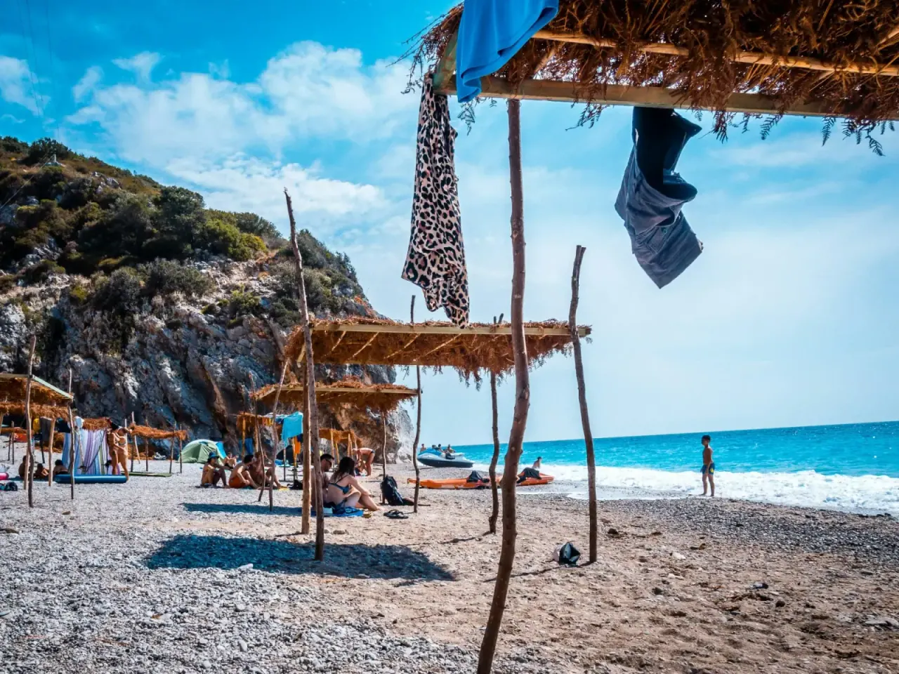 Caves and pebbles at Gjipe Beach