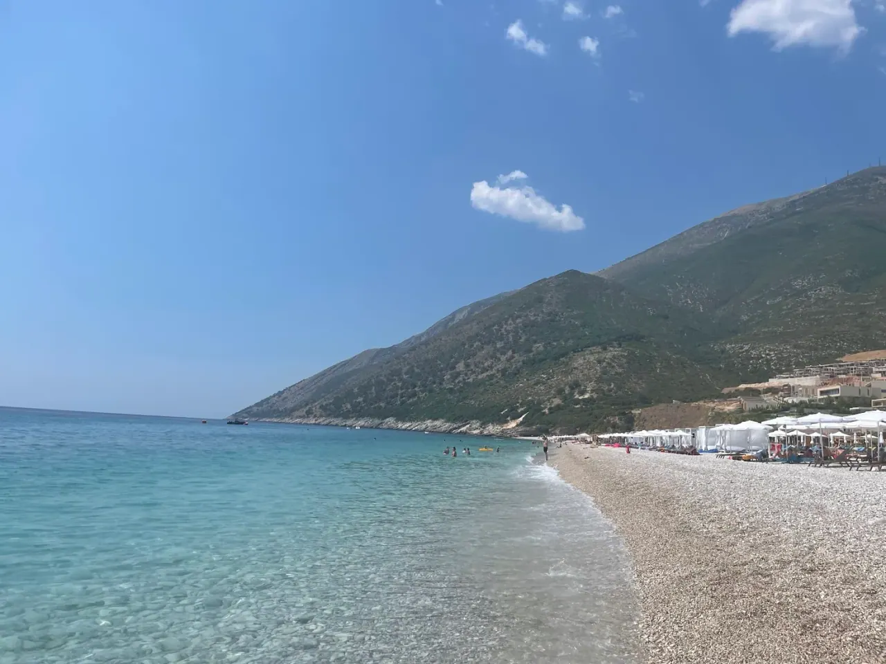 Palasa Beach with white pebbles and clear Ionian water at the northern end of the Albanian Riviera