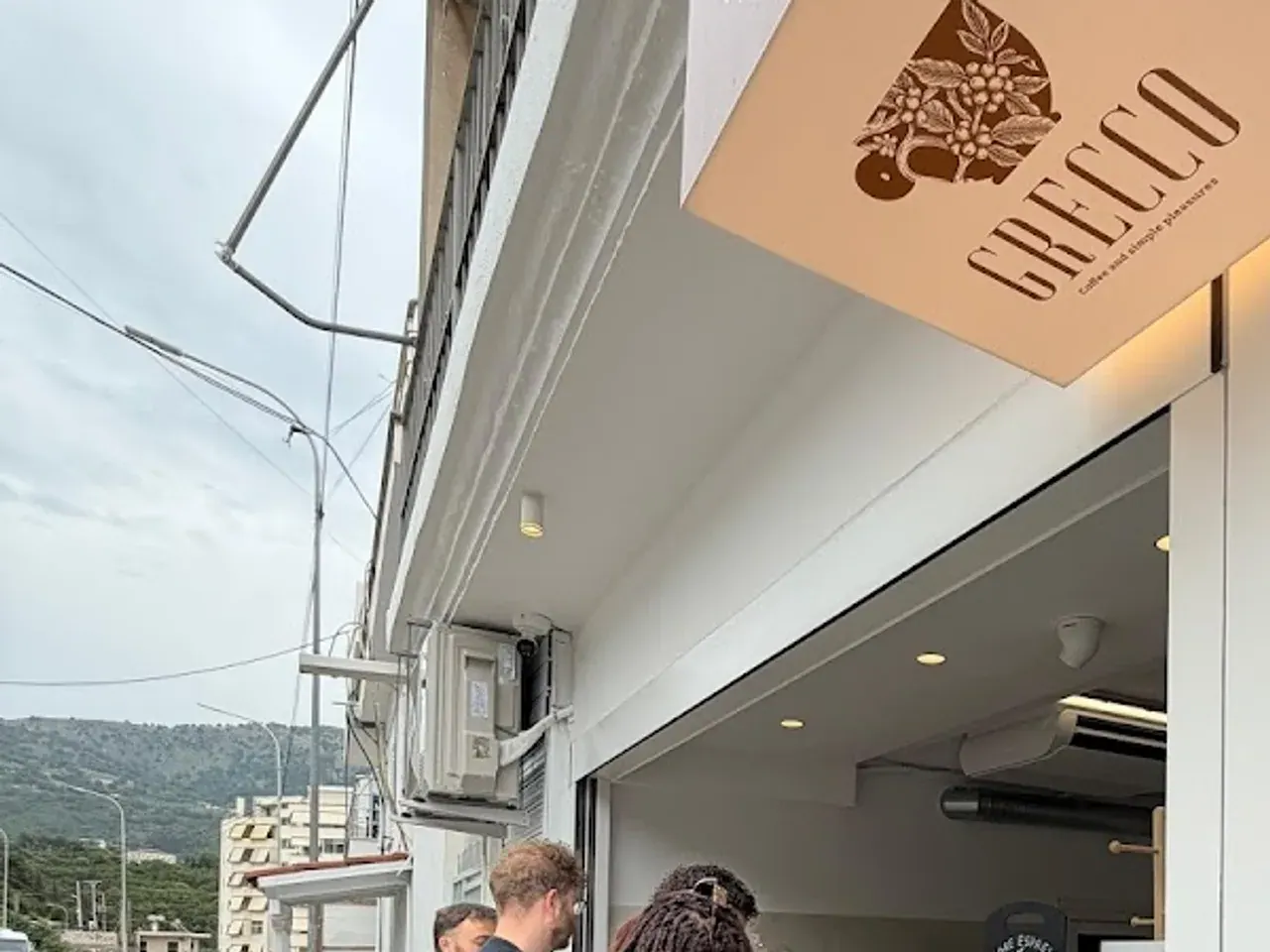 Grecco coffee and pastry kiosk on the main road through central Himara
