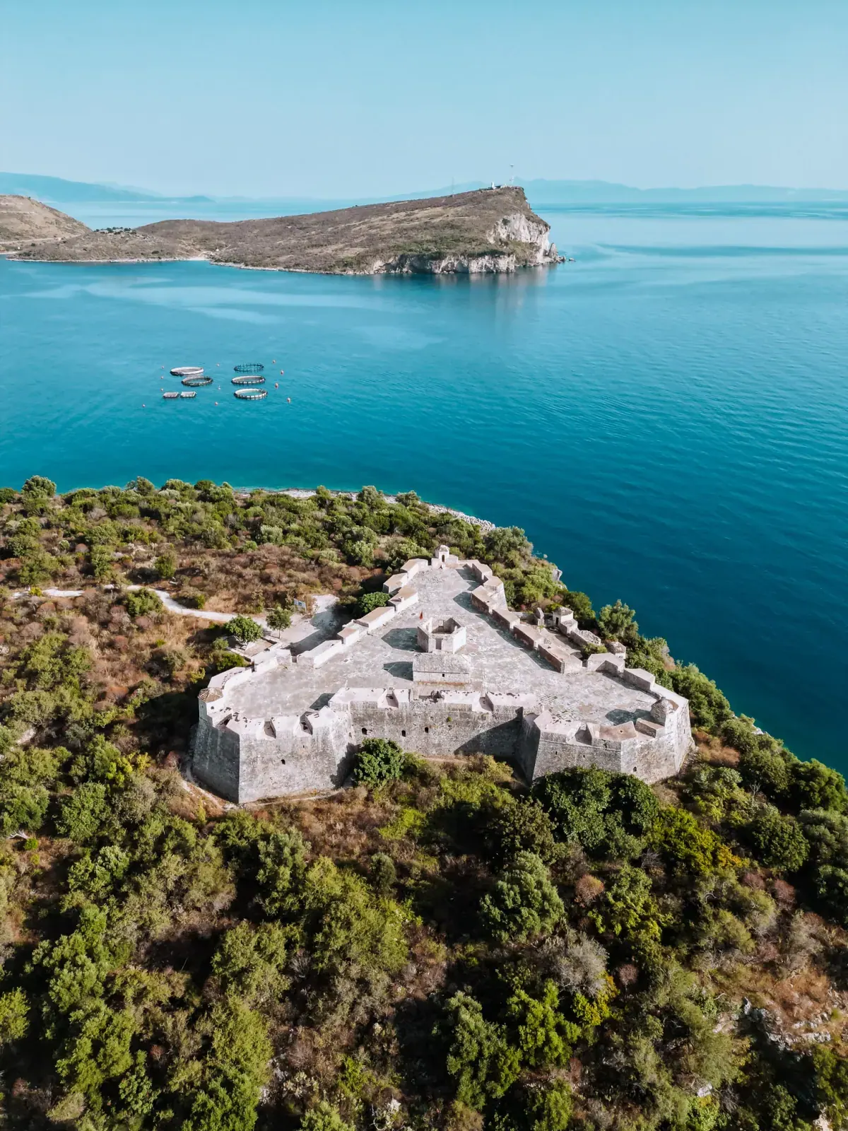 Porto Palermo Castle on its peninsula overlooking the turquoise bay