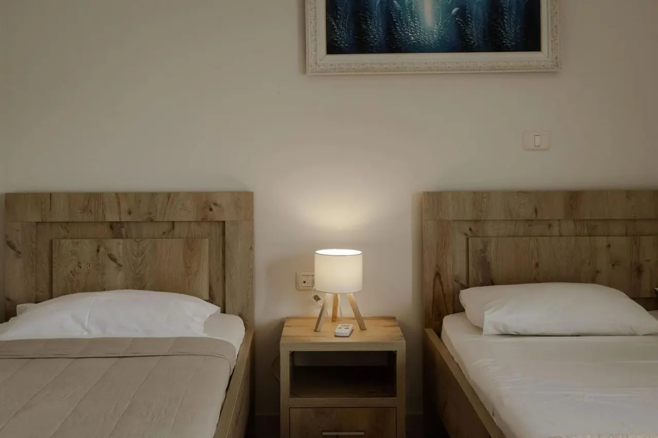 The same triple room from the other side, a picture above the beds