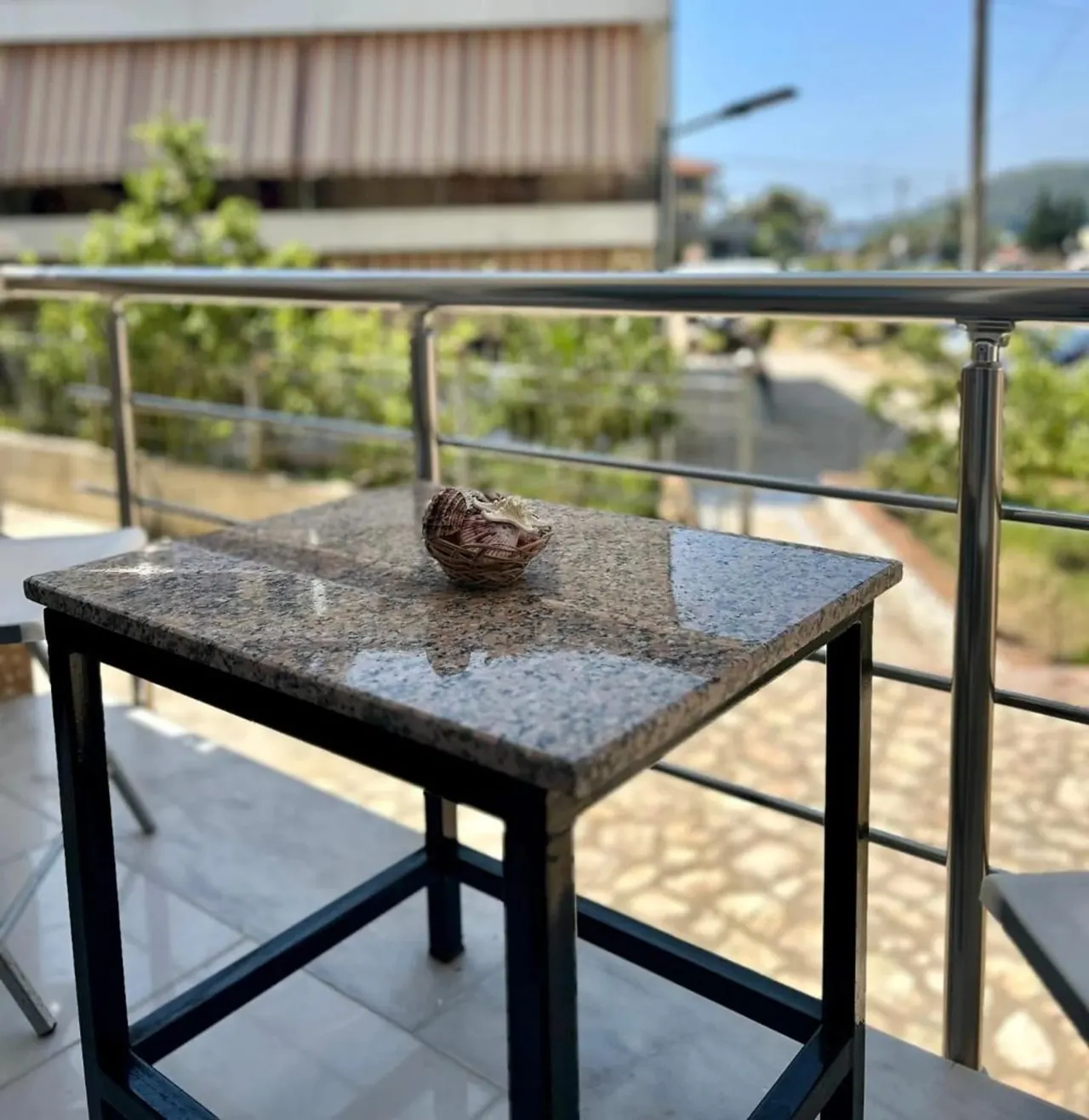 Balcony table looking out over the lane and the hillside