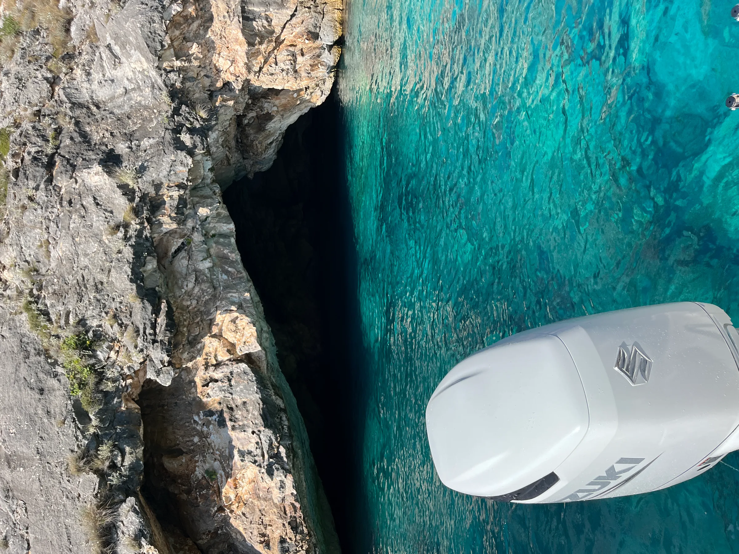 Aerial view of turquoise water at a small cove beach along the Albanian Riviera trail