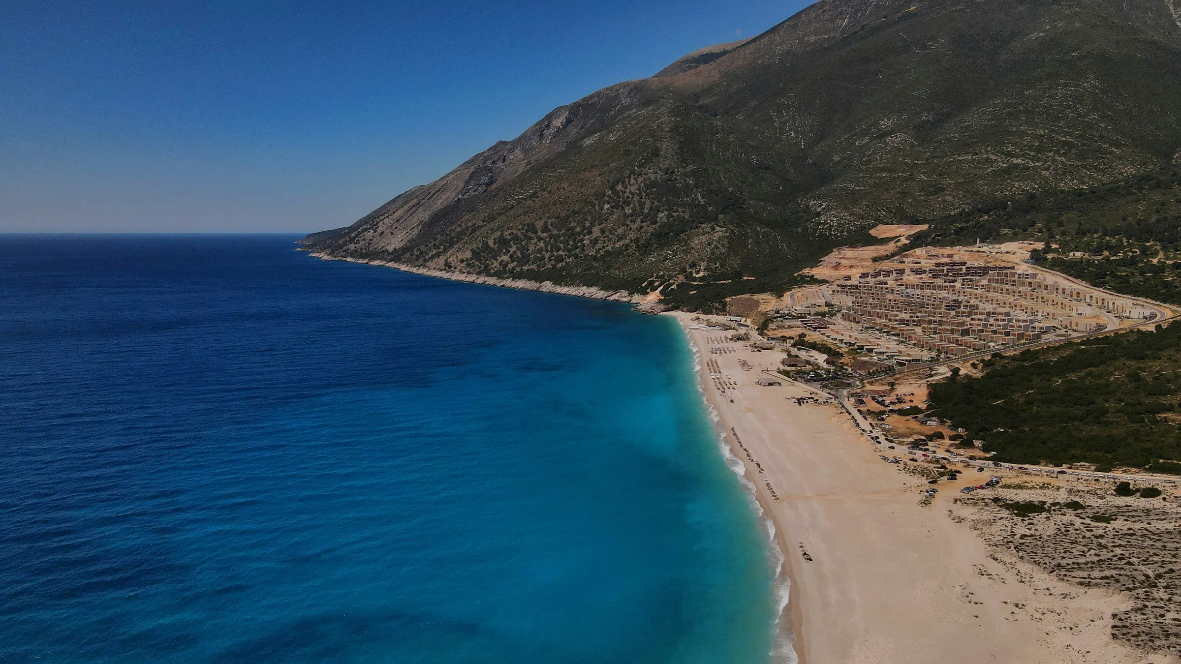 Coastal village landscape tied to traditional Albanian polyphonic singing culture