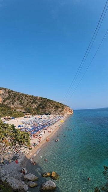Sunset over Spile bay in Himara — the Albanian coast where the country's spirits, wines, and traditions meet