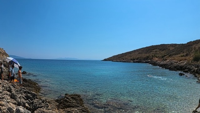 Boat-level view of Himara coastline used for beach-hopping route planning