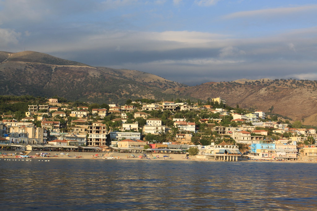 View of Himara bay from the sea with coastline stretching south toward Borsh