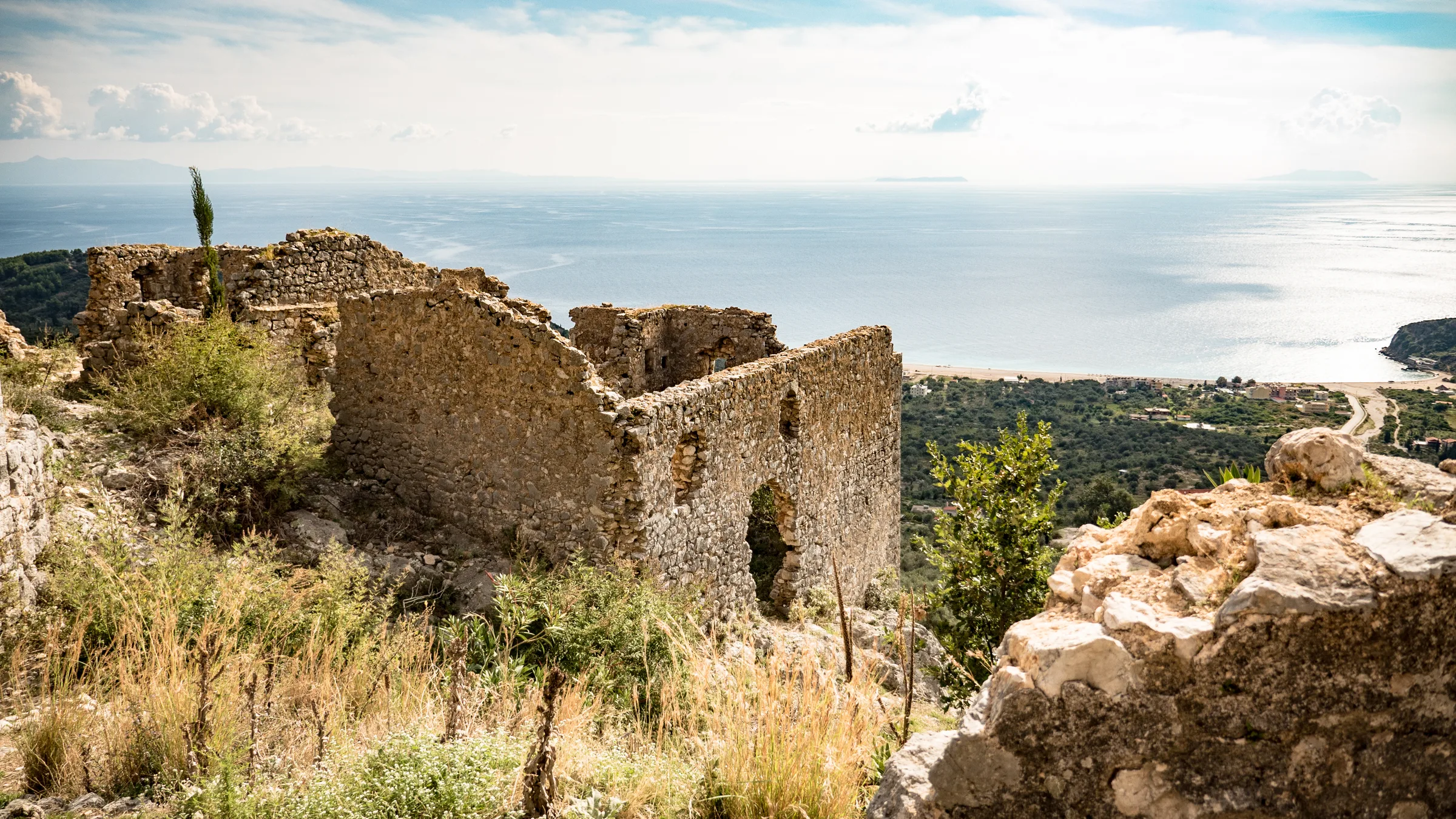Aerial view of Himara castle ruins and the Albanian Riviera coastline