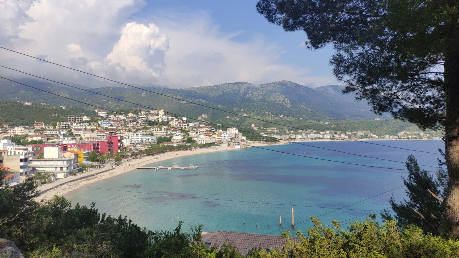 Himara bay panorama with open Ionian Sea and coastal cliffs