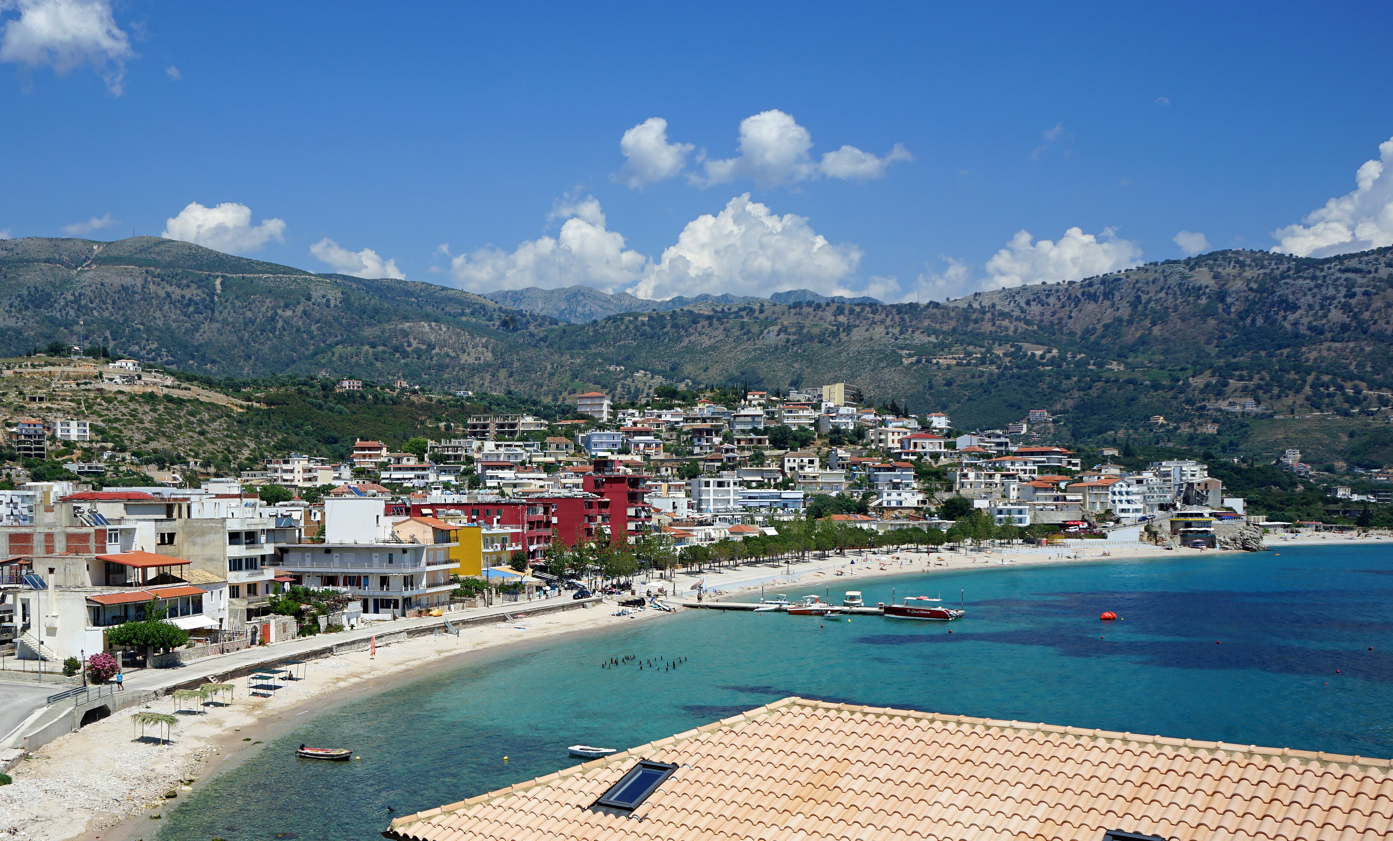 Overview of Himara town beach and promenade area
