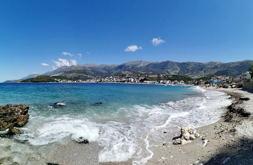 Livadhi Beach coastline with turquoise Ionian water and Ceraunian Mountains