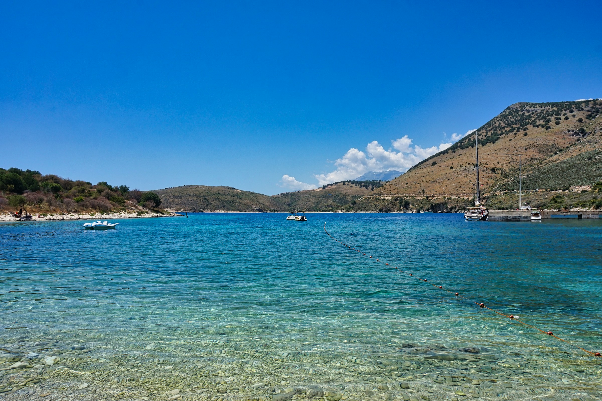 Crystal-clear water at Porto Palermo Bay ideal for snorkeling on the Albanian Riviera