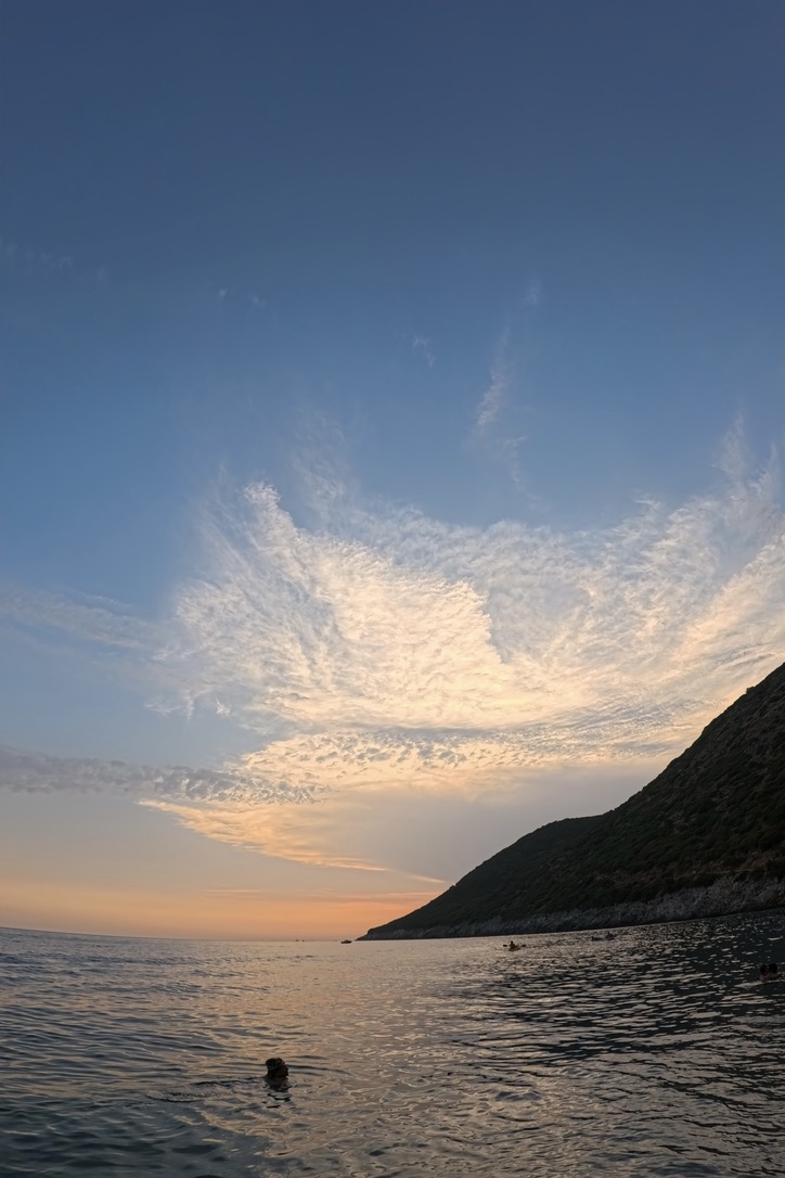 Coastal sunset view with mountain silhouettes along the Albanian Riviera in spring