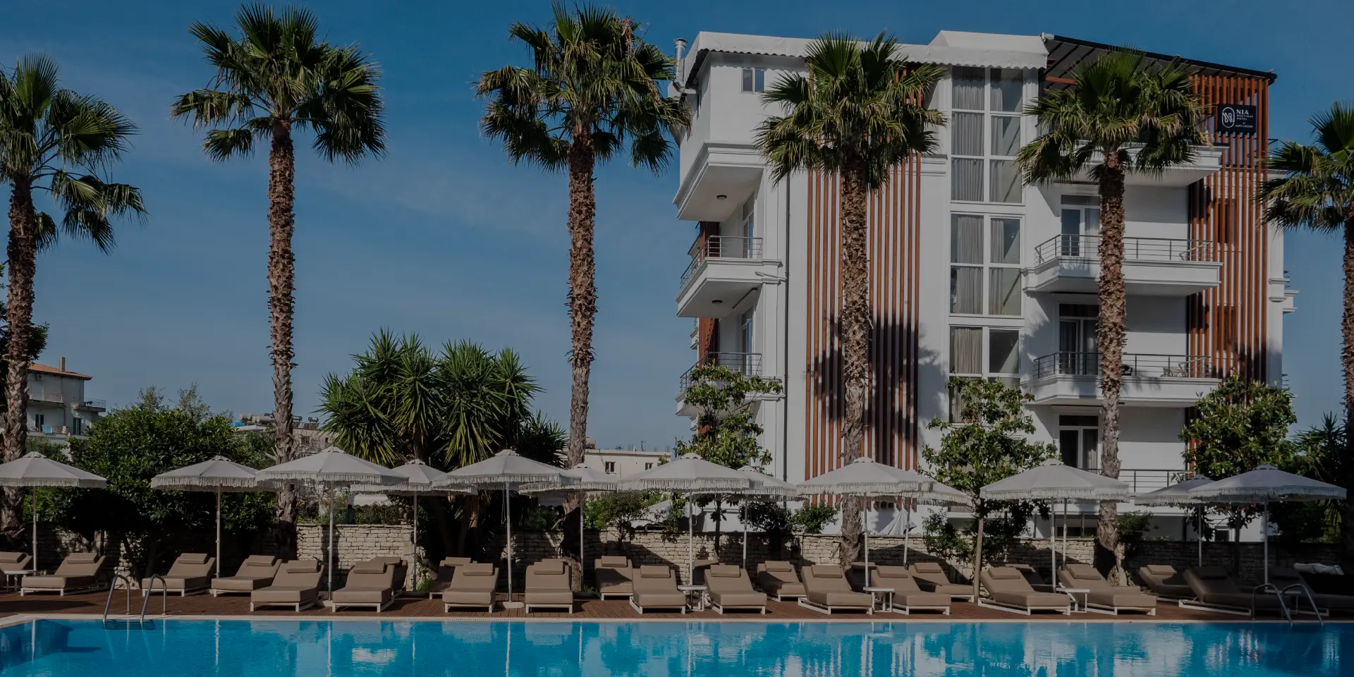 Exterior facade of Nia Boutique Hotel on Himara's promenade