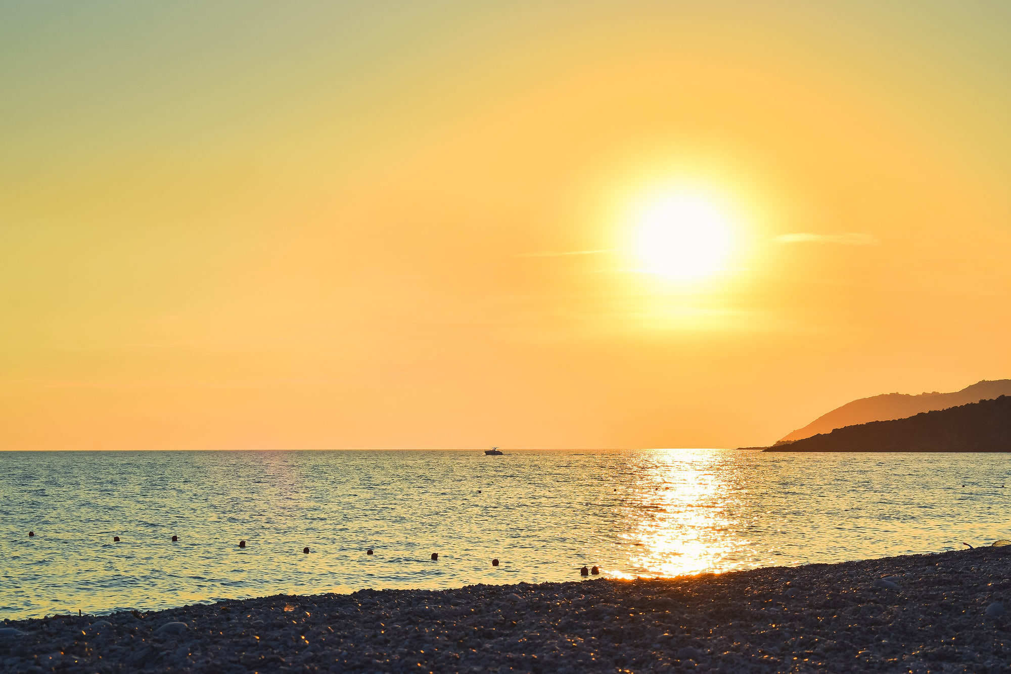 Sunset over the Ionian from the shore at Livadh, Himarë