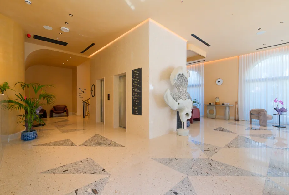 The lobby, terrazzo with triangular aggregate under an arch