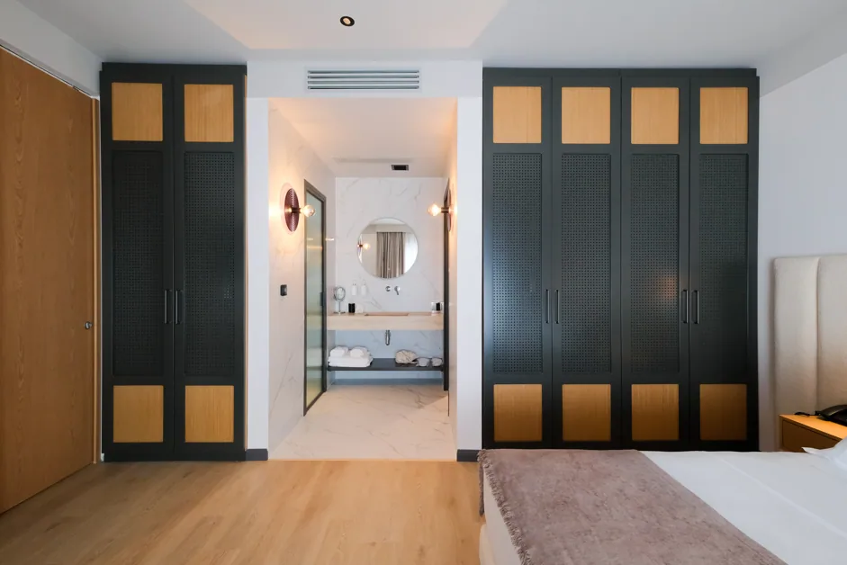 The grey-green wardrobe wall in a Family Room