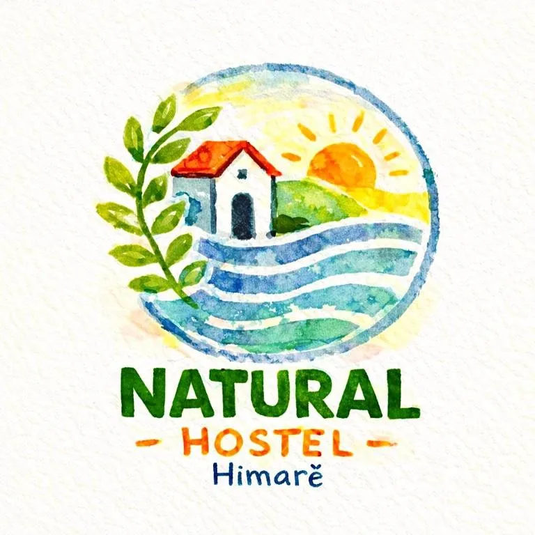 The painted sign of Natural Hostel, Himarë: a whitewashed chapel with a red roof beside an olive branch, a rising sun and bands of sea