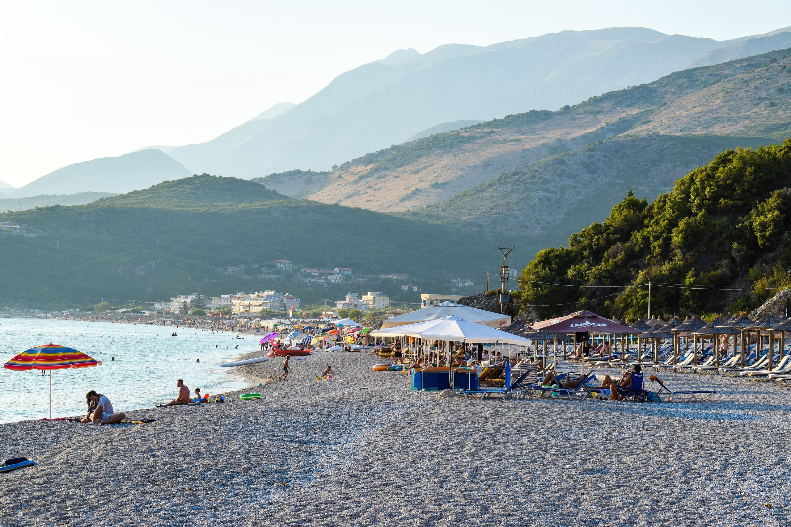 Livadhi Beach below the mountains of Himarë at golden hour