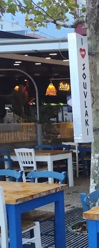 The illuminated white pylon sign reading I heart Souvlaki, set vertically