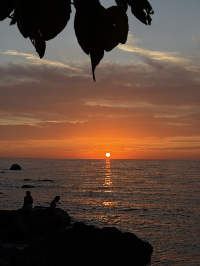 Sunset beach view with umbrellas