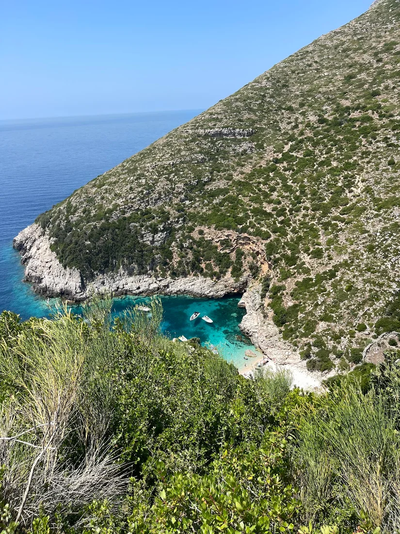Green-cliffed turquoise cove at Bear's Bay on the northern Karaburun Peninsula
