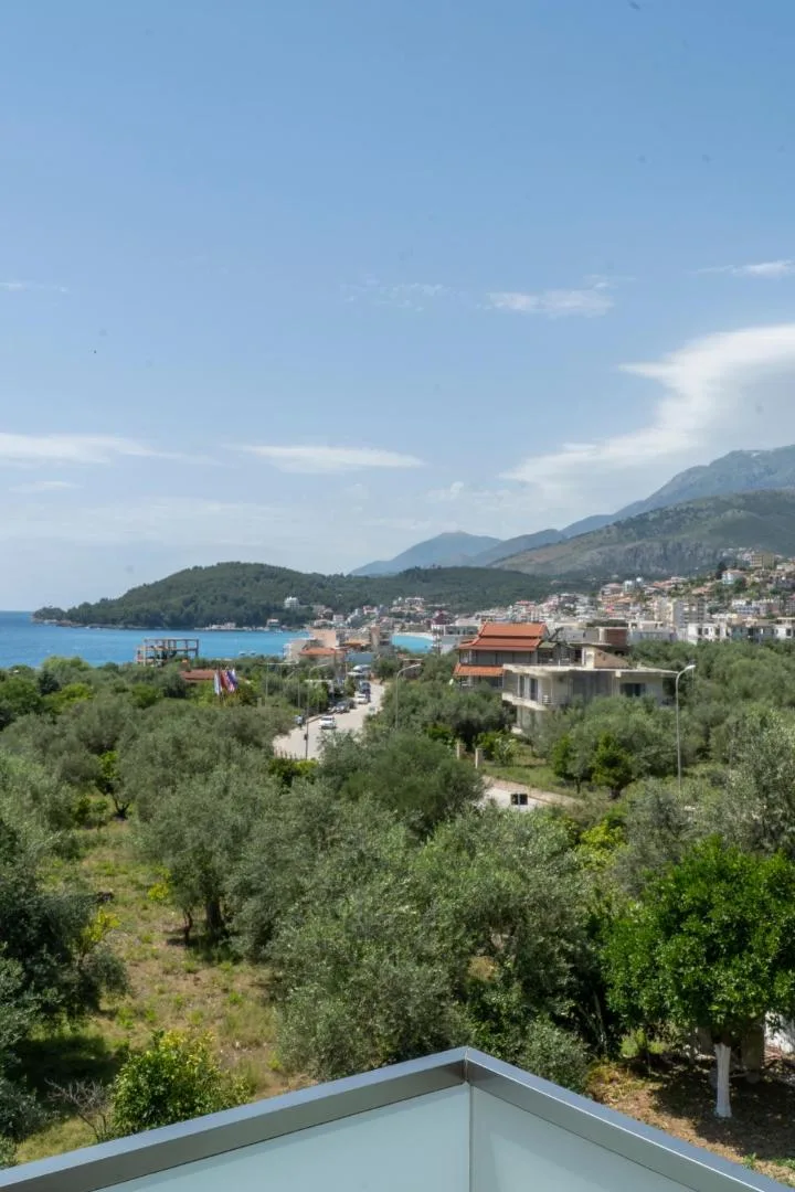 The bay at Himarë seen from an upper balcony over the olive grove