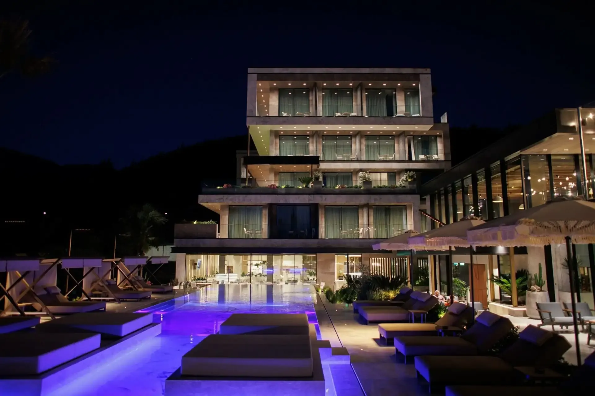 Prado Luxury Hotel after dark, the stepped stone floors lit from within and the pool lit below them