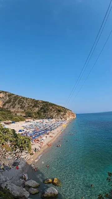 Sunset over Spile bay in Himara — the Albanian coast where the country's spirits, wines, and traditions meet
