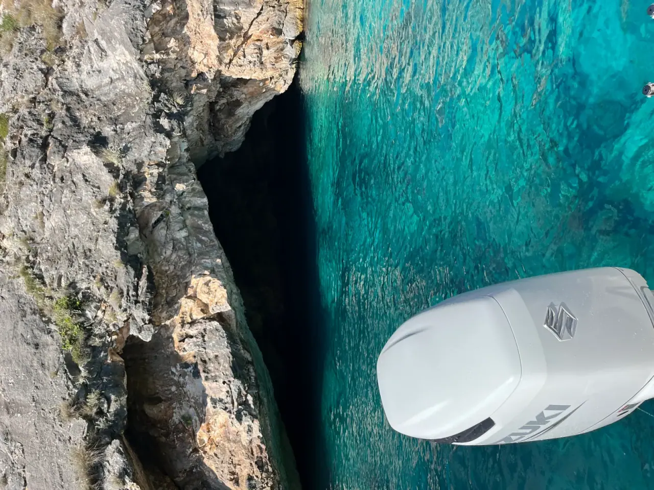 Aerial view of Gjipe Beach with turquoise water surrounded by dramatic canyon cliffs