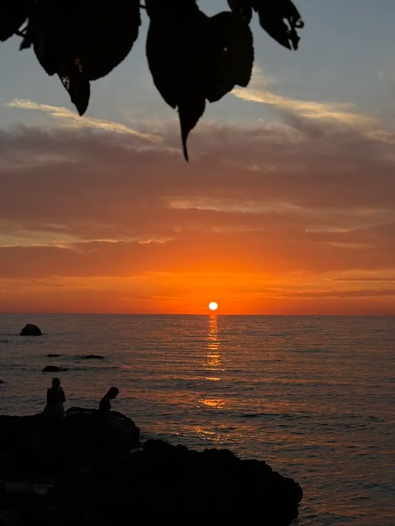 Sunset view along the Himara coastline from a coastal walking path near Spile Beach