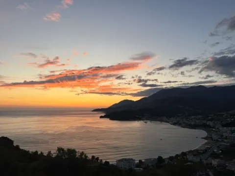 Himara spile bay dusk aerial — paragliding himara llogara