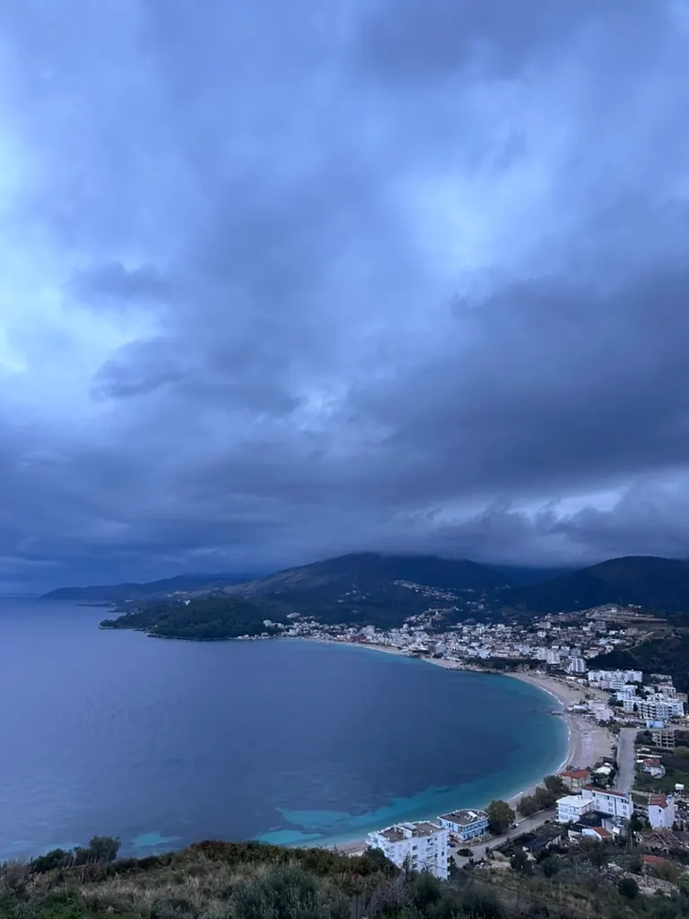 Himara spile bay town aerial — himara rainy day guide