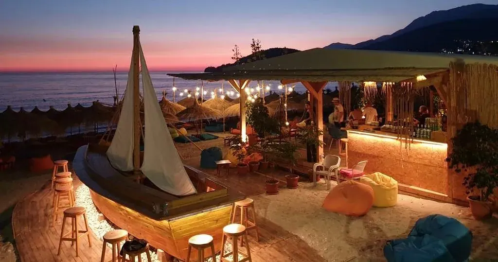 Varka Beach Bar's colorful bean bags and thatched umbrellas on Potami Beach