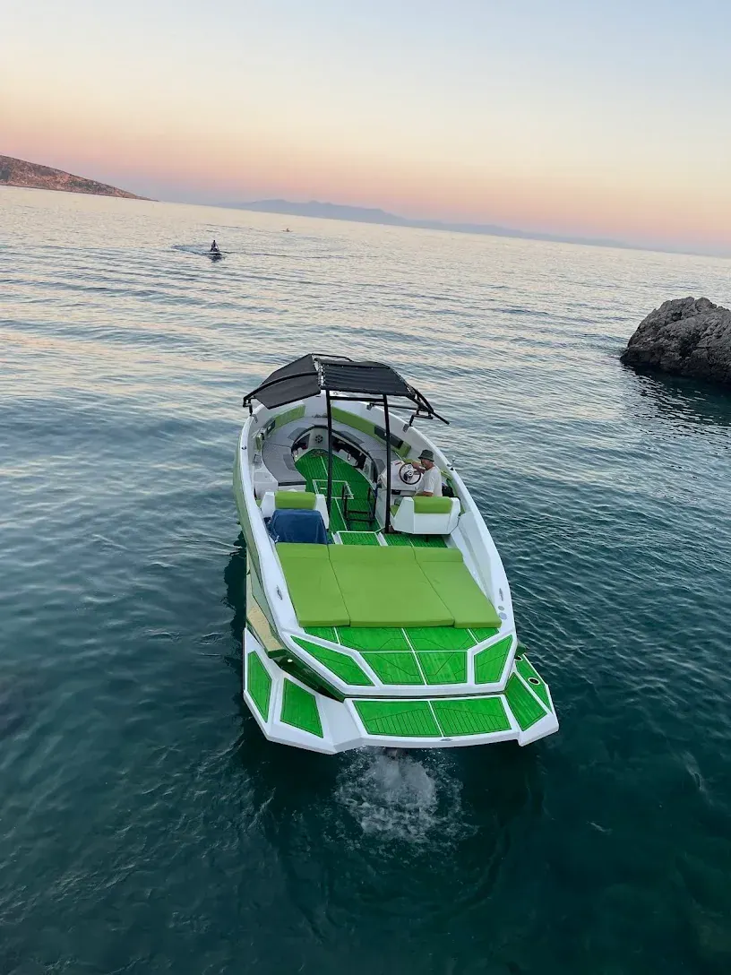 Boat anchored at a swimming stop on a Himara Sea Escapes Albanian Riviera tour