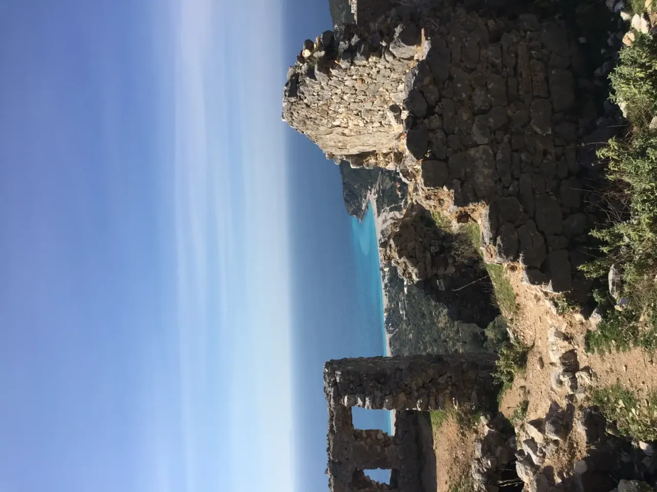 Stone walls and Byzantine church ruins at Himara Castle overlooking the coast