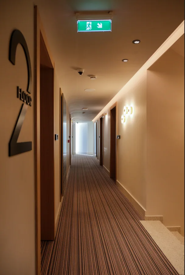 A guest corridor with the floor number set into the wall